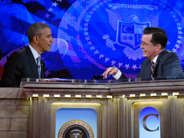 FILE - This Dec. 8, 2014, file photo, shows President Barack Obama talking with Stephen Co