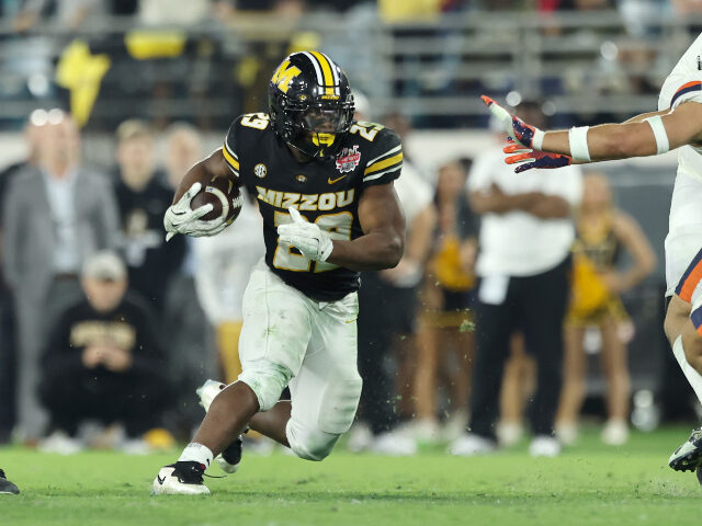 Ahmad Hardy Ahmad Hardy #29 of the Missouri Tigers runs the ball during the 2025 TaxSlayer Gator Bowl