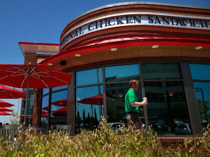 A Chick-fil-A customer walks past the restaurant on August 1, 2012 in Fort Worth, Texas. C
