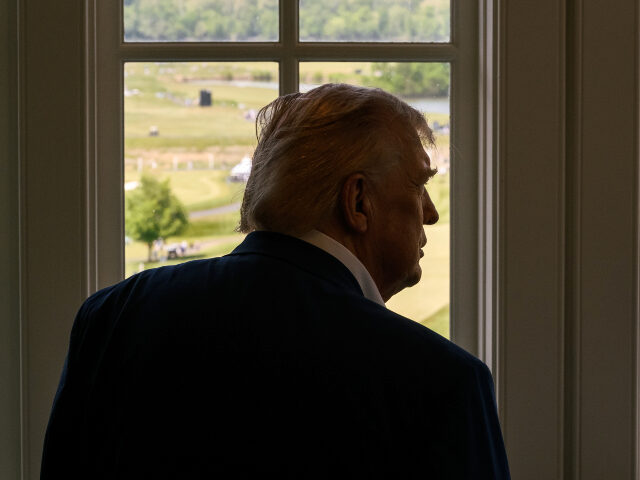 Donald Trump at window 01 President Donald J. Trump watches the LIV Golf tournament at Trump National Golf Club Wash