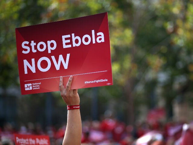 Ebola A nurse holds a sign during a demonstration outside of the Dellums Federal Building on Nov