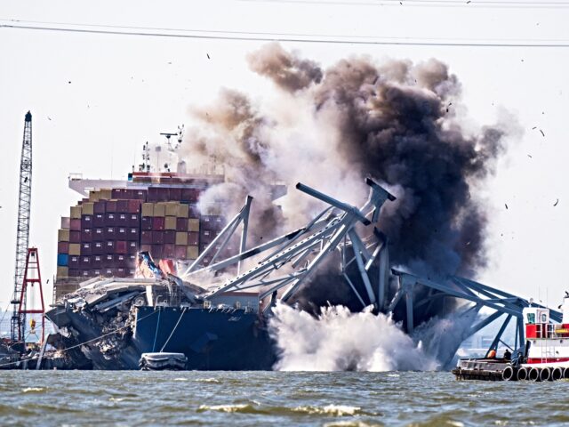 TOPSHOT - Crews conduct a controlled demolition of a section of the Francis Scott Key Brid