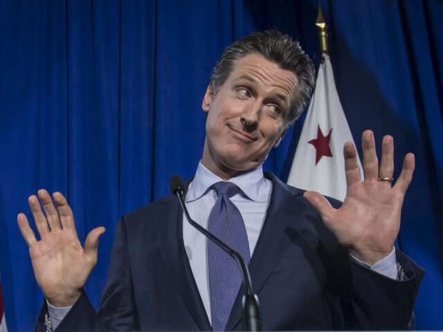 Gavin Newsom, Democratic candidate for governor of California, reacts as his wife Jennifer