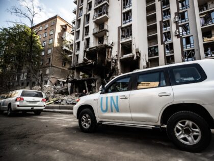 KYIV, UKRAINE - APRIL 29: UN cars pass by an apartment building in the Shevchenkivskyi Dis