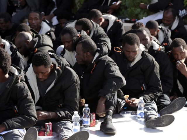 Illegal immigrants wait to depart at Libyan Illegal Migration Control Department in Tripol