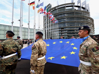 Eurocorps soldiers carry a European Union flag during the flag-raising ceremony on the eve