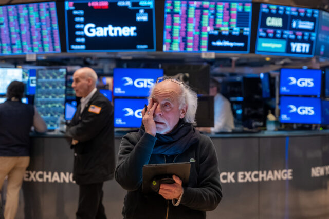 Inflation Fears And Tariff Worries Drag Down Dow Jones Average NEW YORK, NEW YORK - MARCH 28: Traders work on the floor of the New York Stock Exchange (N