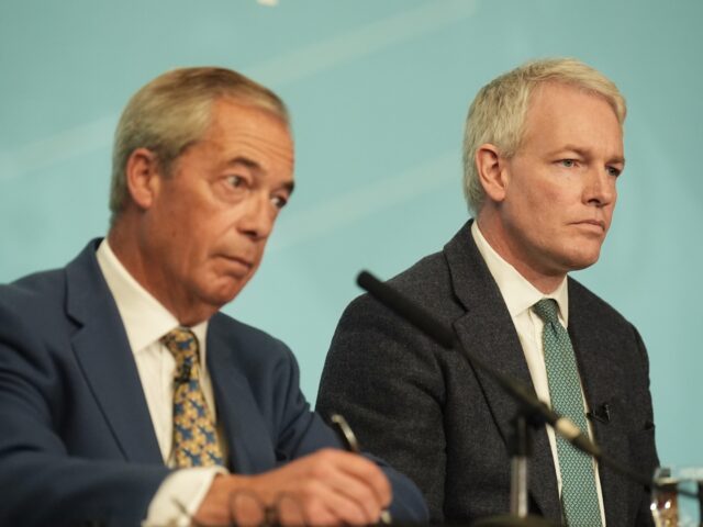 Reform UK leader Nigel Farage (left) with former Conservative MP Danny Kruger, who has def