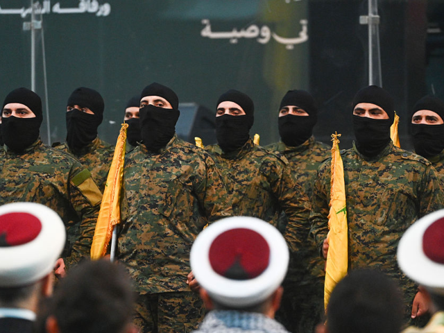Hezbollah supporters gather to listen to the speech of Hezbollah Secretary-General Naim Qa