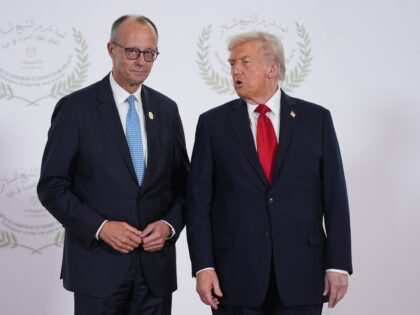 SHARM EL SHEIKH, EGYPT - OCTOBER 13: U.S. President Donald Trump (R) greets Germany's Chan