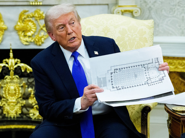 GettyImages-2242326223 US President Donald Trump holds a floor plan of the planned White House Ballroom extension