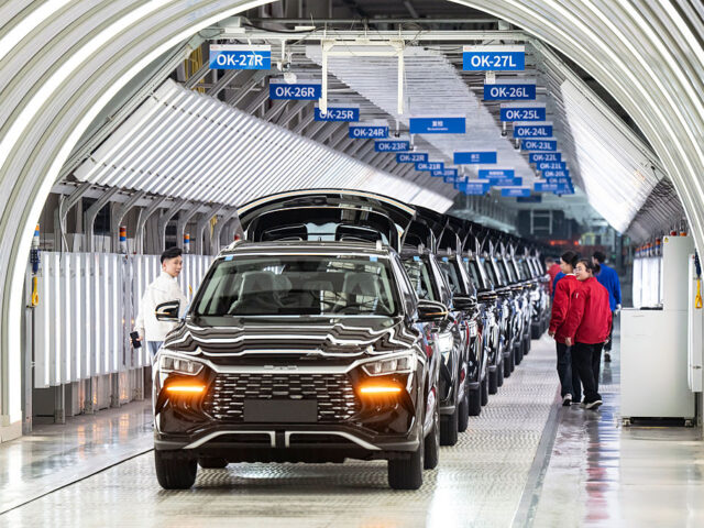 Electric vehicles on the assembly line at the BYD Co. factory in Zhengzhou, Henan province