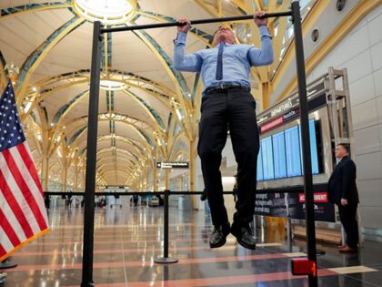 ARLINGTON, VA - DECEMBER 08: Human Services Secretary Robert F. Kennedy Jr. does pull-ups