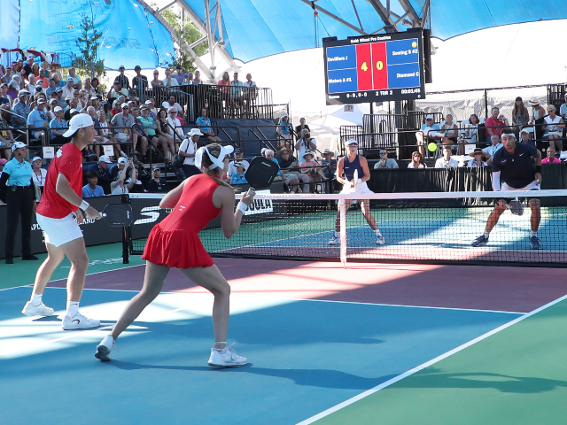 NAPLES, FLORIDA - APRIL 18: Jay Devilliers prepares to hit a volley shot from Sofia Sewing