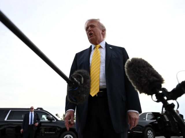 US President Donald Trump speaks with reporters at Palm Beach International Airport in Wes