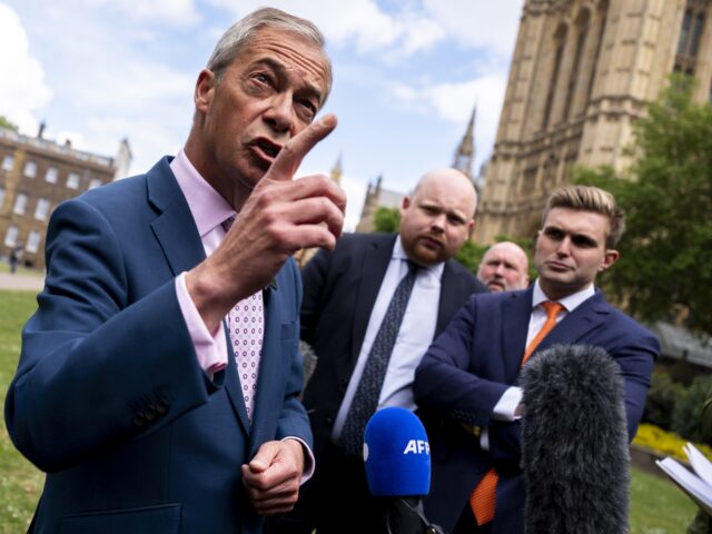 Reform UK leader Nigel Farage being interviewed by the media after an eve of poll photocal