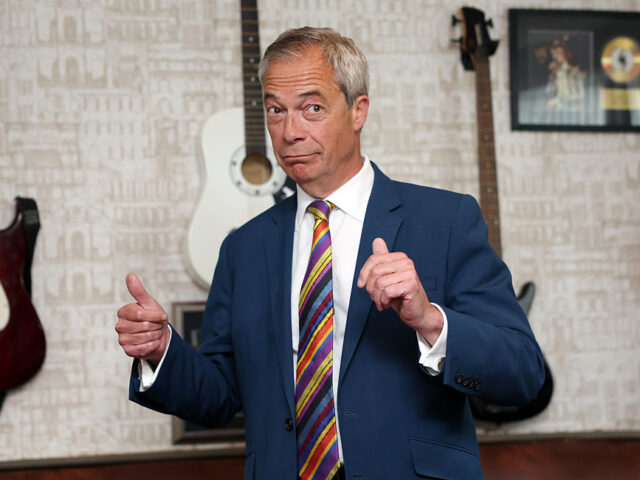 Nigel Farage Celebrates With New Reform Councillors In St Helens ST. HELENS - ENGLAND - MAY 08: Reform UK leader Nigel Farage gives a thumbs up to the medi