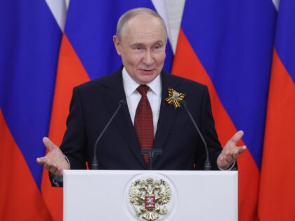 Russian President Vladimir Putin talks to the media following his meetings with foreign de