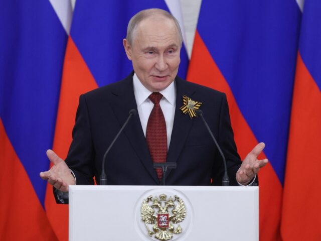 Russian President Vladimir Putin talks to the media following his meetings with foreign de