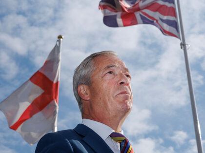 ROMFORD, ENGLAND - MAY 08: Reform UK leader Nigel Farage speaks with media outside Haverin