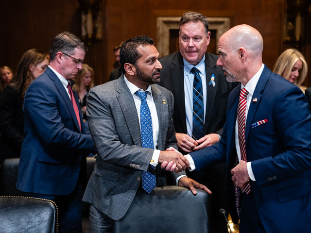 Kash Patel, director of the Federal Bureau of Investigation (FBI), center, greets Terry Co