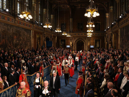 LONDON, ENGLAND - MAY 13: King Charles III, wearing the Imperial State Crown and the Robe