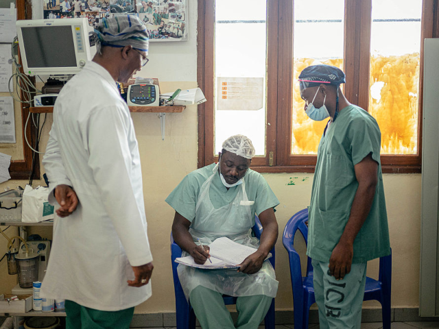 Doctor Soumah Sekou Amadou (L), a senior surgeon working with the International Committee