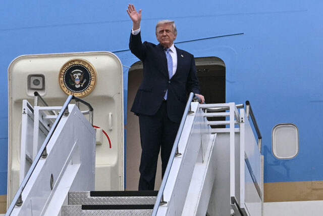 US President Donald Trump boards Air Force One before his departure from Beijing Capital A