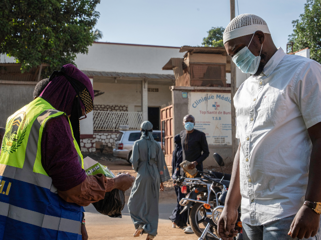 A worshipper has his temperature taken outide a Mosque in Bunia, in the eastern Democratic