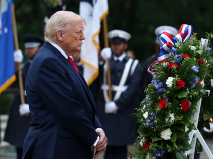 ARLINGTON, VIRGINIA - MAY 25: U.S. President Donald Trump (L) participates in a Memorial D