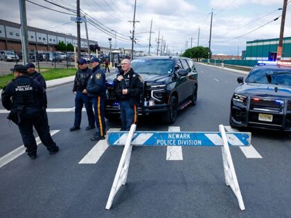 New Jersey State police officers stand guard outside Delaney Hall, which is being used as