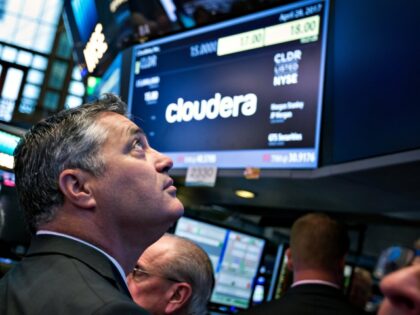 Tom Reilly, chief executive officer of Cloudera Inc., stands during the company's ini
