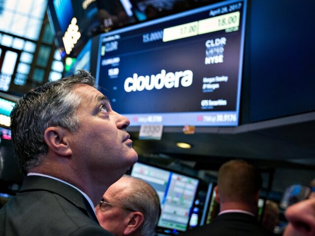 Tom Reilly, chief executive officer of Cloudera Inc., stands during the company's ini