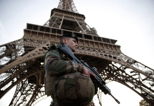 A French soldier, part of the "Operation Sentinelle", patrols in front of the Ei