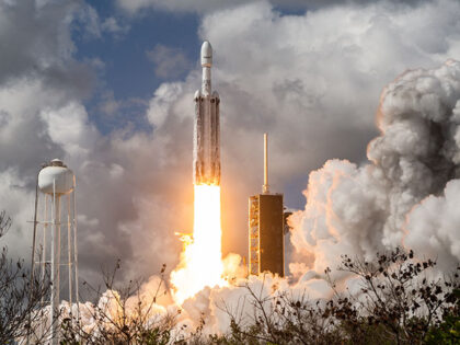 SpaceX Falcon Heavy rocket lifts off from launch pad 39A at the Kennedy Space Center, carr