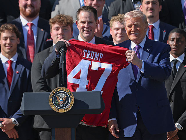 Head Coach Curt Cignetti presents U.S. President Donald Trump with a football jersey as Tr