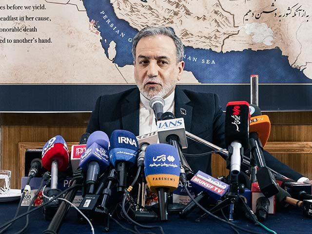 Iran's Foreign Minister Abbas Araghchi attends a press conference at the Iranian embassy o