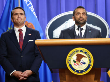 FBI Director Kash Patel speaks as Acting Attorney General Todd Blanche listens at a press