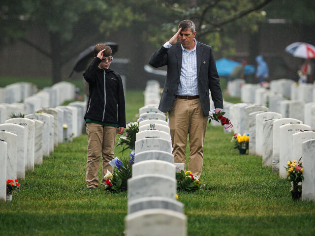 Memorial Day ARLINGTON, VA - MAY 25: Retired U.S. Army Green Beret Michael Gates renders a salute with