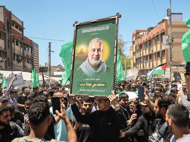CORRECTION / Mourners carry the body of Hamas leader Mohammed Odeh and other Palestinians,