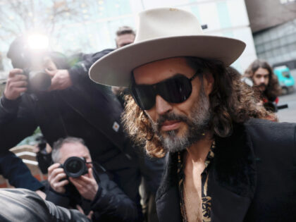 LONDON, ENGLAND - FEBRUARY 24: Russell Brand appears for a hearing regarding the two lates