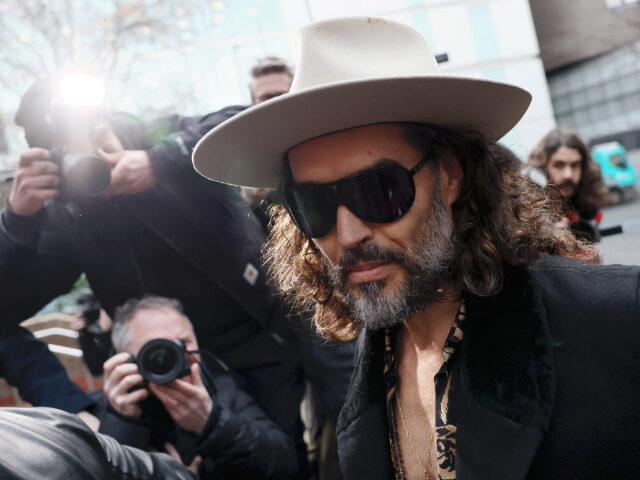 LONDON, ENGLAND - FEBRUARY 24: Russell Brand appears for a hearing regarding the two lates