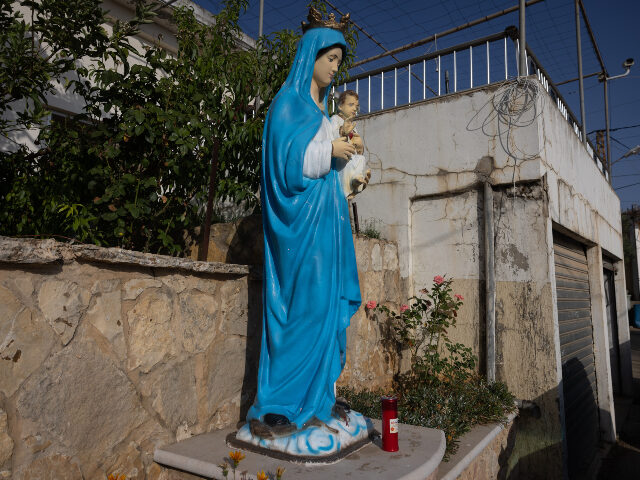 A statue of the Virgin Mary stands in front of a house in the Lebanese Christian town of R