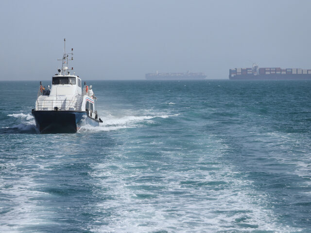 Title: Iran War Strait of Hormuz Image ID: 26124422131063 Article: A patrol boat moves th