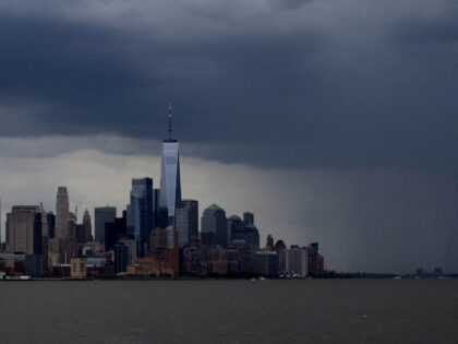 Columns off rain fall between the skyline of lower Manhattan and One World Trade Center in
