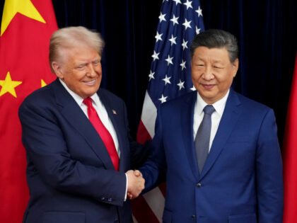U.S. President Donald Trump greets Chinese President Xi Jinping ahead of a bilateral meeti