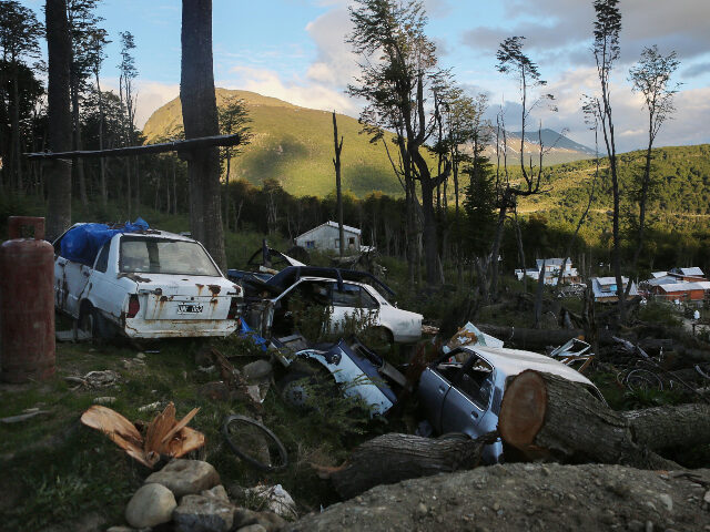 Discarded vehicles sit on the mountainside near an informal settlement on November 10, 201