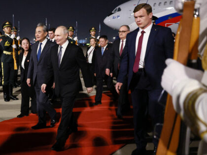 In this pool photograph distributed by the Russian state agency Sputnik, Russia's Pre