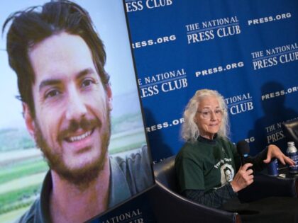 Debra Tice, mother of missing US journalist Austin Tice (displayed on screen), speaks duri
