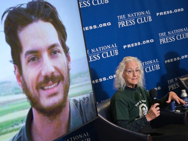 Debra Tice, mother of missing US journalist Austin Tice (displayed on screen), speaks duri